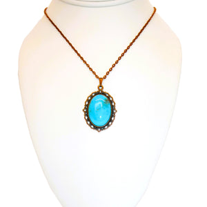 Large oval turquoise cabochon pendant necklaces in fancy copper