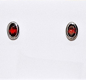 Garnet oval fancy-cut sterling silver post stud earrings