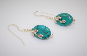 Oval turquoise with two-sided sterling leaf bail on French wires